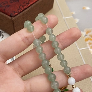 Handmade bracelet featuring natural green chalcedony and freshwater pearl beads