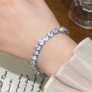 Sparkling silver tennis bracelet with cubic zirconia worn elegantly on a female wrist