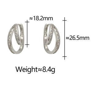 Macro detail of irregular geometric silver earrings with rectangular cubic zirconia