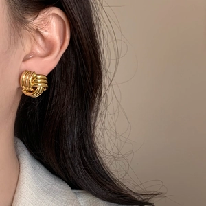 French vintage style chunky twisted gold knot earrings for a fashionable commute look
