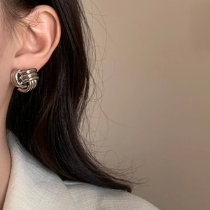 Elegant silver knotted geometric stud earrings for women in a minimalist metallic style