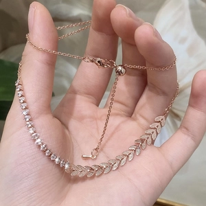 Elegant rose gold wheat leaf pendant necklace with shimmering zircon stones and snake chain