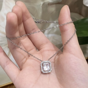 Minimalist gold plated necklace with a sparkling square cut zircon halo pendant design
