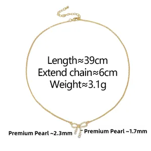 Detail of bow pendant with zircons and pearls showing 39cm chain and 6cm extension