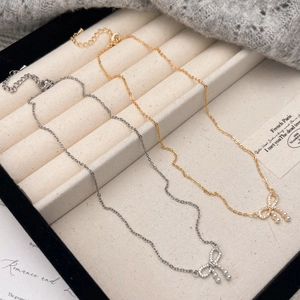Bowknot pearl pendant necklaces in gold and silver finish with zircon accents