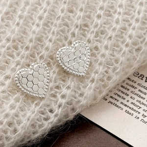 Elegant silver heart earrings with honeycomb texture and shimmering crystal border