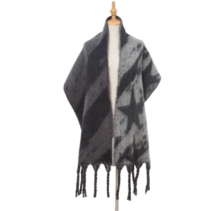 Detail of grey knitted star pattern scarf featuring soft thick fabric and long fringes