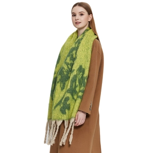 Green mohair-style winter scarf with dark floral jacquard and thick beige fringe tassels