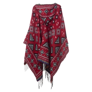 Close-up of geometric jacquard pattern and black fringe on red hooded poncho shawl