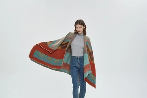 Detailed view of bohemian jacquard shawl with vibrant geometric patterns and lock-stitch edges