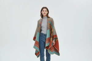 Detailed close-up of bohemian knit shawl featuring vibrant geometric and floral patterns
