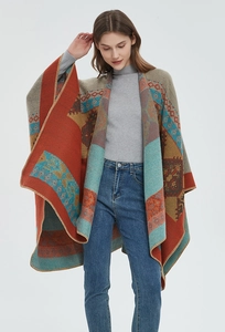 Detail of ethnic geometric jacquard shawl with contrast colors and whipped edge