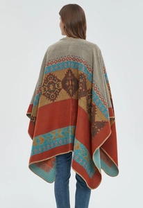 Detail of retro ethnic tribal pattern and fine lockrand stitching on knit shawl