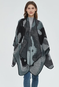 Detail of knitted shawl with abstract marble pattern and black whipstitch edge finishing