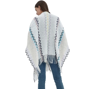 Boho knit shawl for women with colorful wave patterns and tassel hem in a rear view