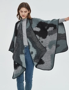 Detail of grey and black leopard jacquard knit shawl with high-quality edge stitching