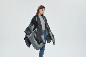 Detail of knit shawl featuring abstract color blocks and neat overlock stitched edges