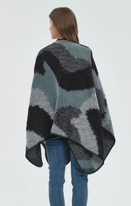 Close-up of jacquard knit texture and reinforced edge stitching on large leopard shawl
