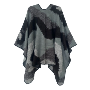 Detail of grey double-sided jacquard knit shawl showing premium overcast edge finish