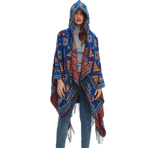 Boho hooded knit poncho with geometric tribal patterns and fringe details for women