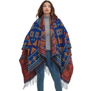 Bohemian hooded knit shawl with colorful geometric patterns and black fringe tassels
