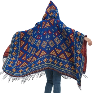 Hooded poncho with blue geometric tribal patterns and black fringe detailing back view