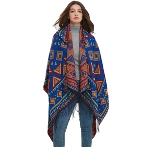 Bohemian hooded poncho with geometric jacquard patterns and long black fringe trim