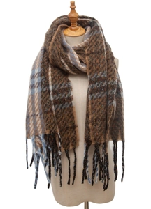 Detail of winter plaid scarf with herringbone pattern, earth tones and tassel edges