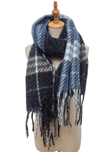 Detail showing plush navy blue and white plaid texture with soft fringed edges on scarf