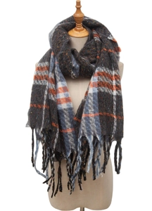 Close-up of thick knitted plaid scarf with orange and blue checks and long fringe