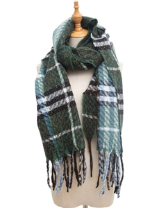 Close-up of thick plaid winter scarf with fringe detail and woven texture