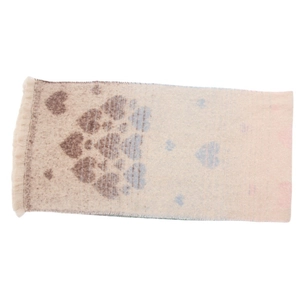 Detail of soft mohair-like scarf with gradient heart patterns and delicate tassel edges