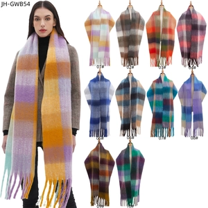 Winter plaid scarf with thick fringe tassels shown in ten color options and on model