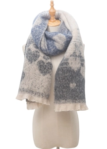 Close-up of thick heart pattern knit scarf with fringe detail in grey and beige