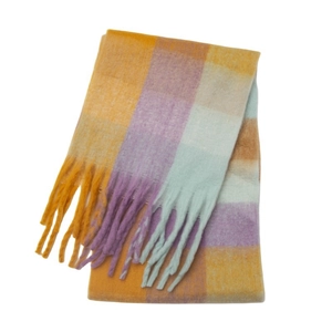 Close-up of winter plaid scarf with yellow, purple, green blocks and long fringes