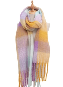 Detailed close-up of thick tassels and colorful checkered knit pattern on the winter scarf