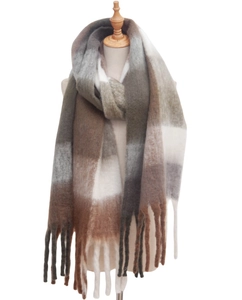 Close-up of thick plaid scarf texture with long tassels in brown and olive green