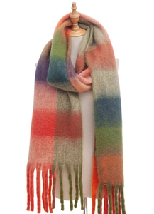 Close-up of thick winter scarf with colorful plaid pattern and long tassels