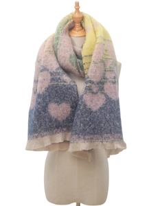 Detail of colorful knitted heart pattern scarf with fringe on a dress form