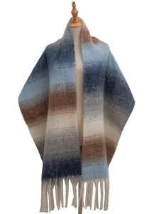 Detail of multi-color gradient striped scarf with thick tassels for autumn and winter