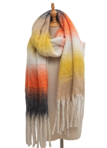 Detailed view of winter thick knit scarf with gradient colors and long tassel accents