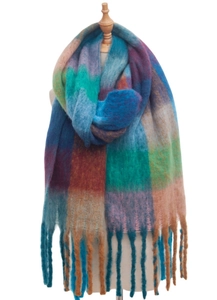 Detail of colorful plaid scarf with long twisted tassels and textured fuzzy knit fabric