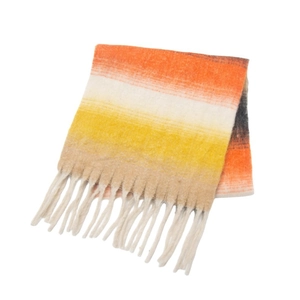 Close-up of chunky knit gradient scarf with long tassels in orange and yellow tones