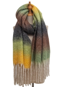 Close-up of thick tassels and gradient knit texture on a long winter loop yarn scarf