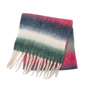 Close-up of chunky knit gradient scarf with long cream fringes and thick boucle texture