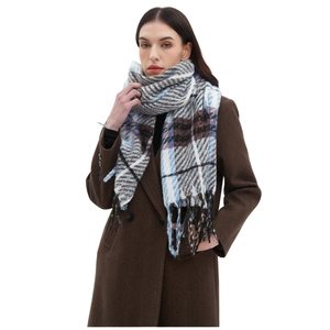 Winter plaid scarf with tassels in blue and grey checks paired with a brown wool coat