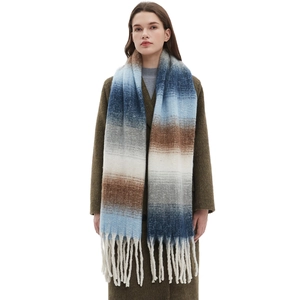 Blue and beige gradient thick tassel scarf shown on a model with a dark green coat