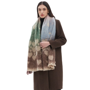 Thick faux mohair scarf with heart jacquard pattern and fringes worn over a coat