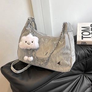 Large grey tote bag with crinkle texture, silver chain strap and plush charm