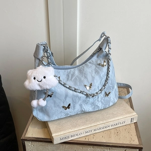 Light blue pleated tote bag with silver chain, butterfly motifs and plush cloud charm